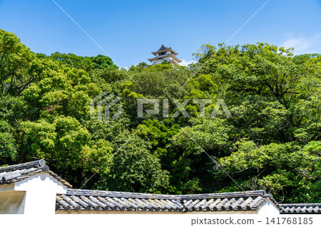 Standing tall against the blue sky is the keep of Marugame Castle in Kagawa Prefecture, one of the twelve remaining original castle keeps in Japan. Standing tall against the blue sky is the keep of Marugame Castle in Kagawa Prefecture, one of the twelve remaining original castle keeps in Japan. 141768185