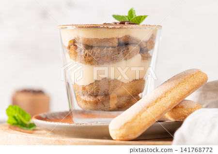 Traditional Tiramisu Dessert in a Glass Cup Traditional Tiramisu Dessert in a Glass Cup 141768772
