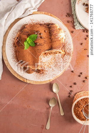 Top view of homemade traditional tiramisu cake Top view of homemade traditional tiramisu cake 141768777