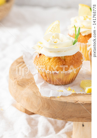 Delicious lemon cupcake with sweet buttercream top Delicious lemon cupcake with sweet buttercream top 141768778