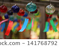 Wind chimes swaying in the wind 141768792
