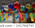 Wind chimes swaying in the wind 141768795