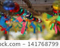 Wind chimes swaying in the wind 141768799