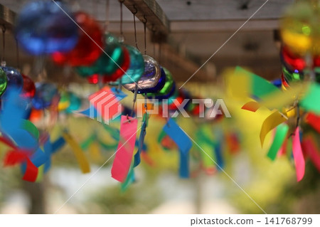 Wind chimes swaying in the wind Wind chimes swaying in the wind 141768799