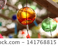 Wind chimes swaying in the wind 141768815