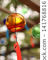 Wind chimes swaying in the wind 141768816
