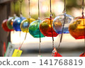 Wind chimes swaying in the wind 141768819