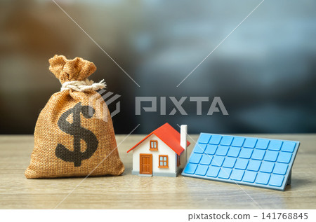 Dollar money bag and a house with solar panels. Profit from home power generation. Green tariff. Subsidies and grants for the purchase of autonomous home systems. Dollar money bag and a house with solar panels. Profit from home power generation. Green tariff. Subsidies and grants for the purchase of autonomous home systems. 141768845