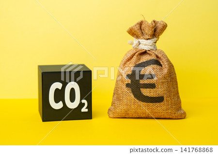 A CO2 cube and a euro money bag. Waste recycling and profit generation. Recycling grants. Reducing environmental impact while generating income. Increase in the cost of emission quotas for enterprises A CO2 cube and a euro money bag. Waste recycling and profit generation. Recycling grants. Reducing environmental impact while generating income. Increase in the cost of emission quotas for enterprises 141768868
