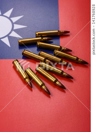 Assault rifle cartridges on the taiwanese flag, serving as a conceptual background for defense Assault rifle cartridges on the taiwanese flag, serving as a conceptual background for defense 141768928