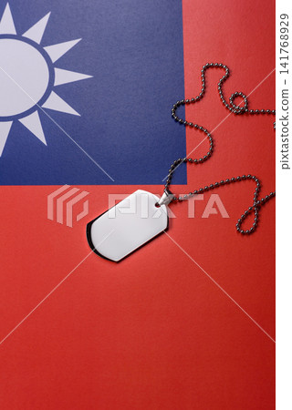 A dog tag on the taiwanese flag, serving as a conceptual backdrop representing defense A dog tag on the taiwanese flag, serving as a conceptual backdrop representing defense 141768929