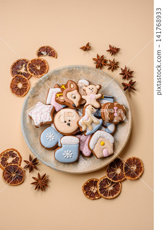 Gingerbread as a Christmas staple, sweet biscuits for the holiday. Gingerbread as a background Gingerbread as a Christmas staple, sweet biscuits for the holiday. Gingerbread as a background 141768933