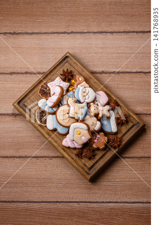 Gingerbread as a Christmas staple, sweet biscuits for the holiday. Gingerbread as a background Gingerbread as a Christmas staple, sweet biscuits for the holiday. Gingerbread as a background 141768935