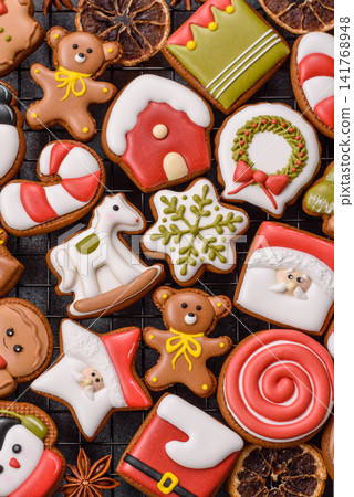 Gingerbread as a Christmas staple, sweet biscuits for the holiday. Gingerbread as a background Gingerbread as a Christmas staple, sweet biscuits for the holiday. Gingerbread as a background 141768948