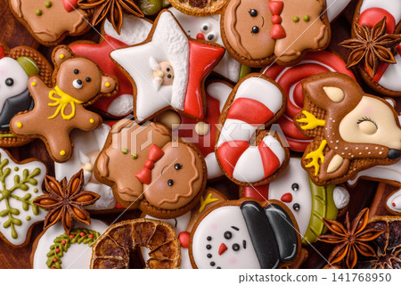Gingerbread as a Christmas staple, sweet biscuits for the holiday. Gingerbread as a background Gingerbread as a Christmas staple, sweet biscuits for the holiday. Gingerbread as a background 141768950