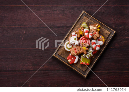 Gingerbread as a Christmas staple, sweet biscuits for the holiday. Gingerbread as a background 141768954