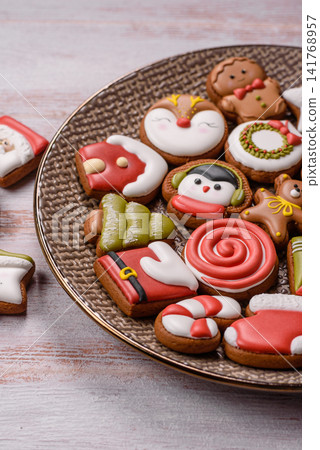 Gingerbread as a Christmas staple, sweet biscuits for the holiday. Gingerbread as a background Gingerbread as a Christmas staple, sweet biscuits for the holiday. Gingerbread as a background 141768957
