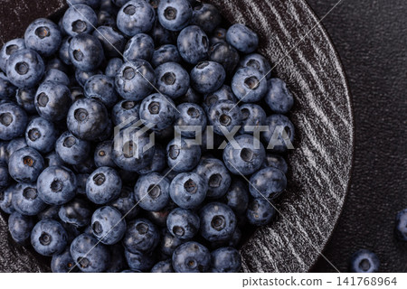 Fresh, ripe, and juicy wild blueberries as an ingredient for vegetarian dishes Fresh, ripe, and juicy wild blueberries as an ingredient for vegetarian dishes 141768964