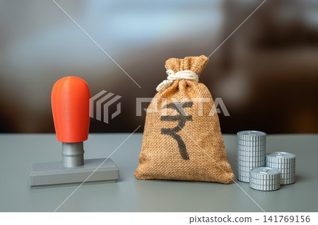 Office seal and indian rupee money bag. Permits and orders. Budget tax revenues. Accounting management. Budget and financial management. Office seal and indian rupee money bag. Permits and orders. Budget tax revenues. Accounting management. Budget and financial management. 141769156