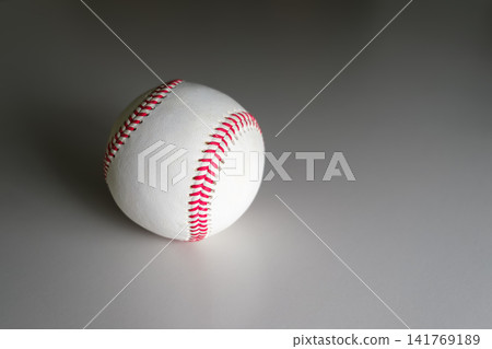 A baseball illuminated by a spotlight A baseball illuminated by a spotlight 141769189