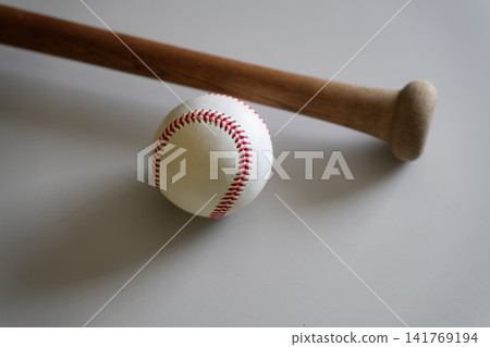 Close-up of a wooden bat and baseball Close-up of a wooden bat and baseball 141769194