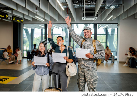 Military soldier arriving at airport for family reunion Military soldier arriving at airport for family reunion 141769653