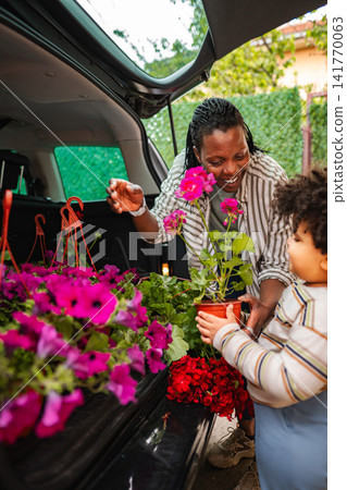 Mother and daughter bonding while buying plants for gardening Mother and daughter bonding while buying plants for gardening 141770063