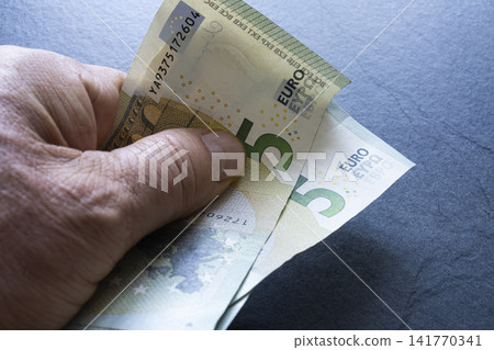 several 5 euro banknotes several 5 euro banknotes 141770341