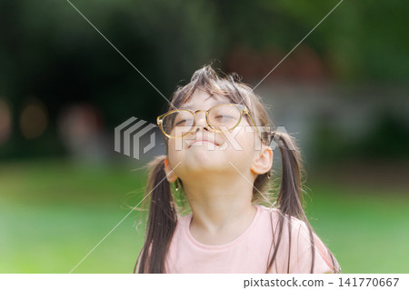 Girl wearing sunglasses Girl wearing sunglasses 141770667