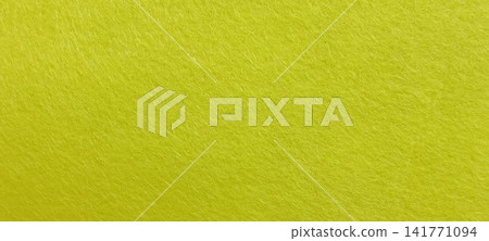 Vibrant lime green textured surface closeup Vibrant lime green textured surface closeup 141771094