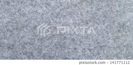 Gray textured fabric closeup with soft fibers and neutral tone Gray textured fabric closeup with soft fibers and neutral tone 141771112