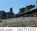 A view of a crane at a demolition site. 141771537