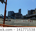A view of a crane at a demolition site. 141771538