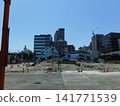 A view of a crane at a demolition site. 141771539