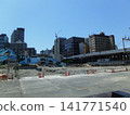 A view of a crane at a demolition site. 141771540