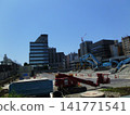 A view of a crane at a demolition site. 141771541