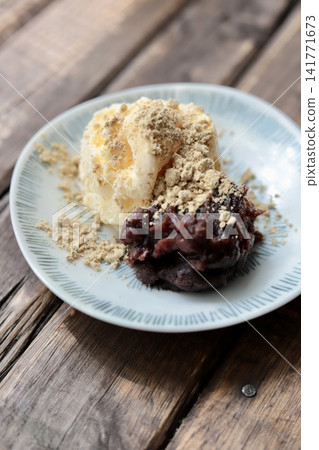 Creamy zenzai (sweet red bean soup) with coarse red bean paste topped with black soybean kinako (roasted soybean flour). Creamy zenzai (sweet red bean soup) with coarse red bean paste topped with black soybean kinako (roasted soybean flour). 141771673