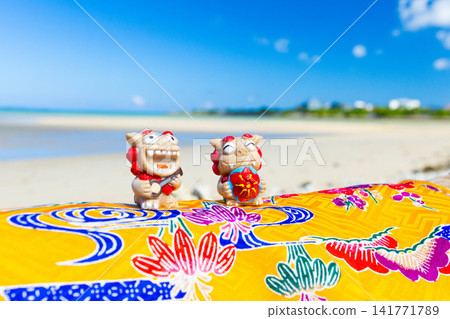 Okinawa's sea and Shisa statues Okinawa's sea and Shisa statues 141771789