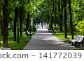 A park with a fountain in the city park in summer. 141772039