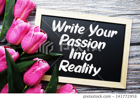 Write Your Passion Into Reality text written on notepad with flower decoration on wooden background Write Your Passion Into Reality text written on notepad with flower decoration on wooden background 141772958