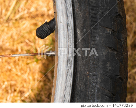 Air valve on bicycle tyre Air valve on bicycle tyre 141773289