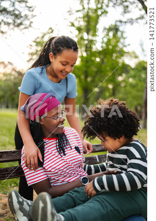 African American mother children spending time together in park African American mother children spending time together in park 141773521