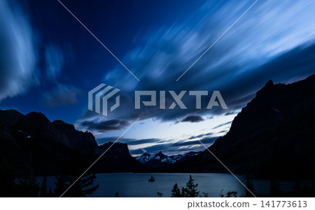 Dramatic Twilight Mountain Lake with Long Exposure Clouds Dramatic Twilight Mountain Lake with Long Exposure Clouds 141773613