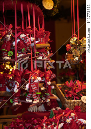Handmade Christmas Doll Ornaments Hanging at Traditional Holiday Market Stall Handmade Christmas Doll Ornaments Hanging at Traditional Holiday Market Stall 141773811
