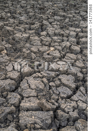 Cracked earth during extreme drought conditions Cracked earth during extreme drought conditions 141773868