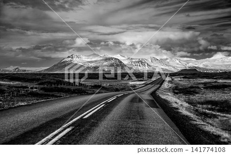 Black and White Mountain Road Landscape Under Dramatic Sky Black and White Mountain Road Landscape Under Dramatic Sky 141774108