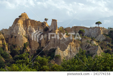 Scenic Eroded Cliffs and Pine Trees in Mountain Landscape Scenic Eroded Cliffs and Pine Trees in Mountain Landscape 141774158