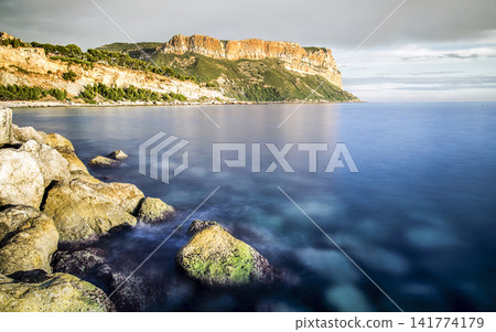 Coastal Cliffs and Calm Blue Sea Long Exposure Landscape 141774179