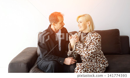Woman And Man Converse On Sofa In Cozy Interior, Attentive Listening And Gentle Gestures, Emotional Counseling Atmosphere, Compassionate Empathy, Confidential Exchange Offering Comfort And Guidance Woman And Man Converse On Sofa In Cozy Interior, Attentive Listening And Gentle Gestures, Emotional Counseling Atmosphere, Compassionate Empathy, Confidential Exchange Offering Comfort And Guidance 141774393