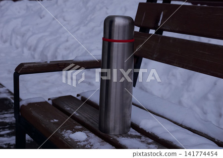 Silent Snowy Park With Cozy Drink Container. Chilly Urban Park Morning Featuring Insulated Steel Flask And Snow. Tranquil Winter Scene In City Park With Insulated Container And Fresh Snow Cover Silent Snowy Park With Cozy Drink Container. Chilly Urban Park Morning Featuring Insulated Steel Flask And Snow. Tranquil Winter Scene In City Park With Insulated Container And Fresh Snow Cover 141774454